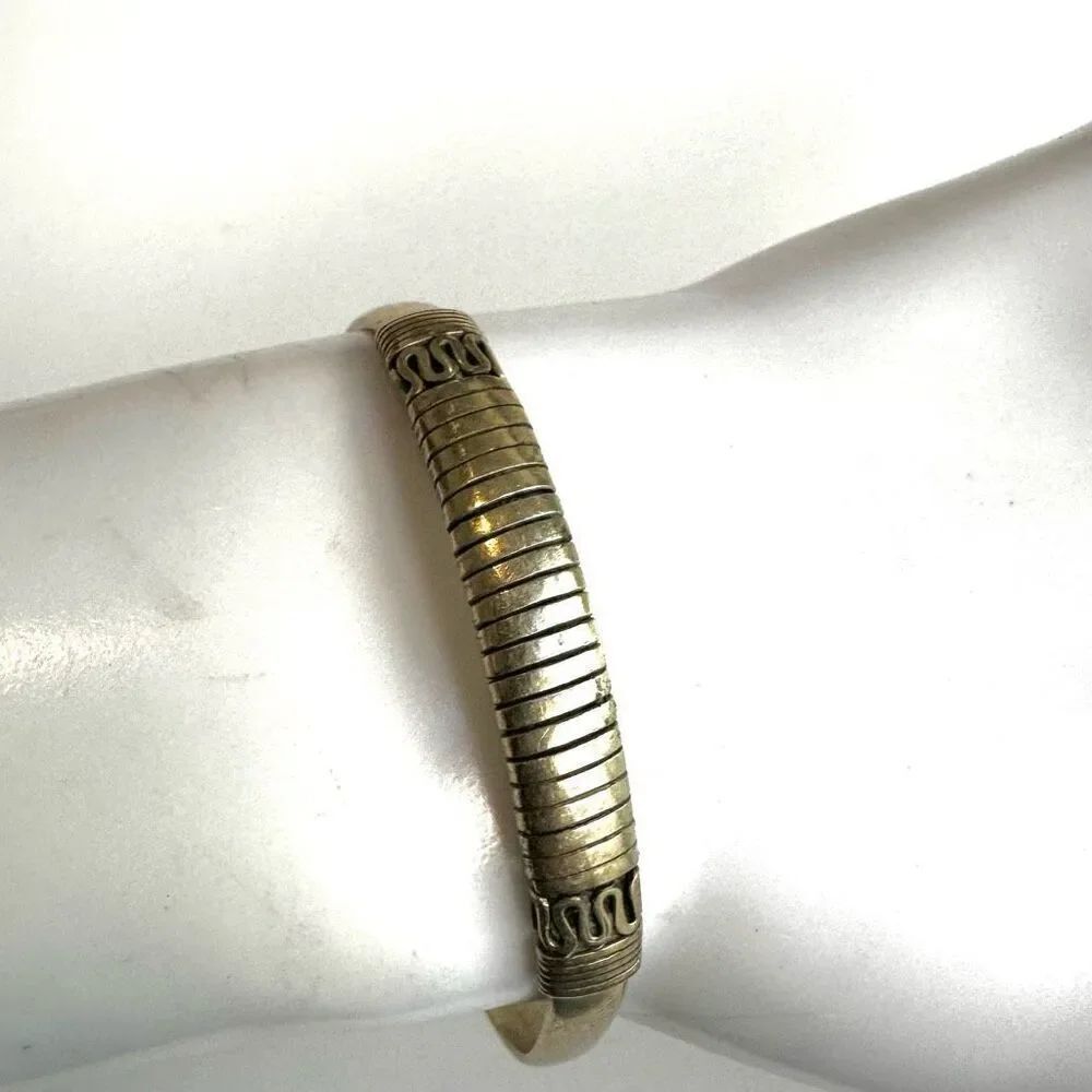 Gold tone etched open cuff bracelet